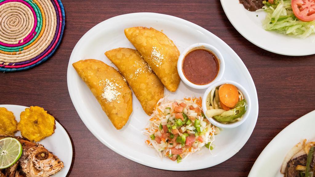 Fried Ground Beef Pies (Pastelitos De Maíz) (3 Pieces) · Served with grated Honduran cheese and in-house-made salsa.