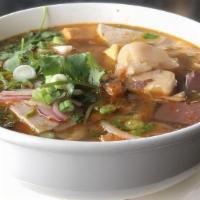 Bun Bo Hue · Spicy beef noodle soup round rice noodles, pork sausage, beef shank, tendon, black pudding, ...