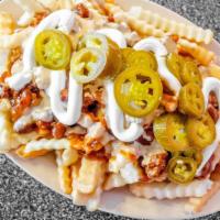 Chili Cheese Fries · Crinkle cut fries smothered in chili, American cheese, sour cream, and jalapeños!