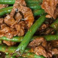 L Prik Khing · (SPICY) Stir-fried with string bean,  lime leaves in our homemade chili past sauce.