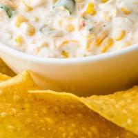 Corn Dip · Niblet corn, cream cheese, green chilis, and spices. Just order it. It's delicious.