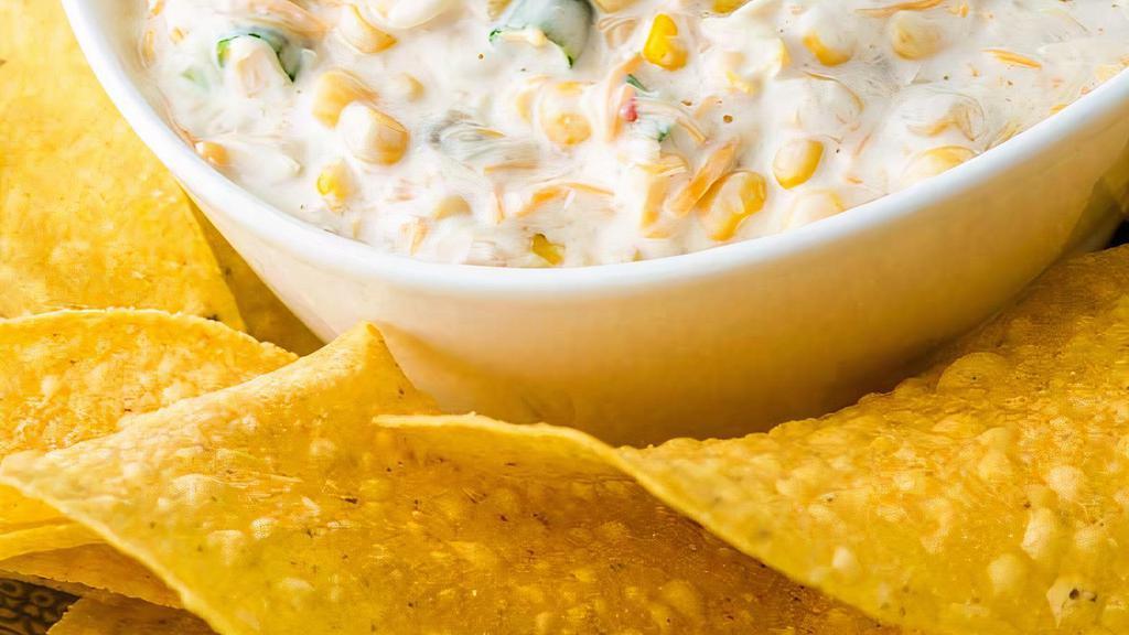 Corn Dip · Niblet corn, cream cheese, green chilis, and spices. Just order it. It's delicious.