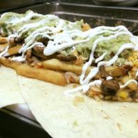 Burrito Mi Pueblito · Our biggest burrito filled with rice, beans, french fries, mix cheese, sour cream, guacamole...