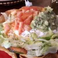 27 Taco Salad · A Crisp Flour Tortilla topped with Seasoned Ground Beef or Chicken, Lettuce, Tomatoes, Chedd...