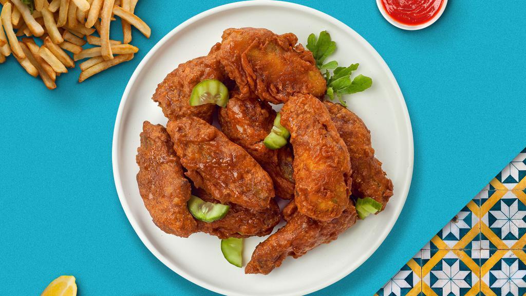 Hot In Nashville Tenders · Chicken tenders breaded, fried until golden brown before being tossed in Nashville Hot sauce. Served with your choice of dipping sauce.
