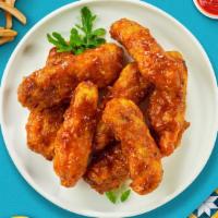 Mythical Mango Habanero Tenders · Chicken tenders breaded, fried until golden brown before being tossed in mango habanero sauc...