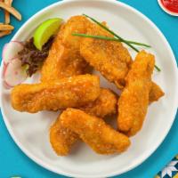 Baffling Buffalo Tenders · Chicken tenders breaded and fried until golden brown before being tossed in buffalo sauce. S...