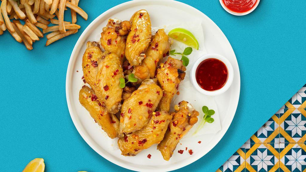 Red Hot Sweet Chili Tenders · Chicken tenders breaded, fried until golden brown before being tossed in sweet chili sauce. Served with your choice of dipping sauce.