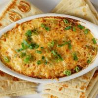Crab Dip · Fresh crab meat seasoned and baked in a cheesy cream sauce with green peppers and white onio...