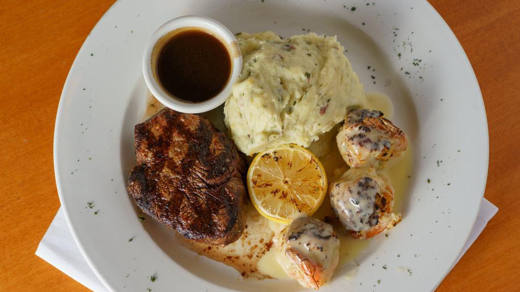 Surf And Turf · Tender 5oz char-grilled filet, lightly seasoned and served with three stuffed jumbo shrimp and one side item