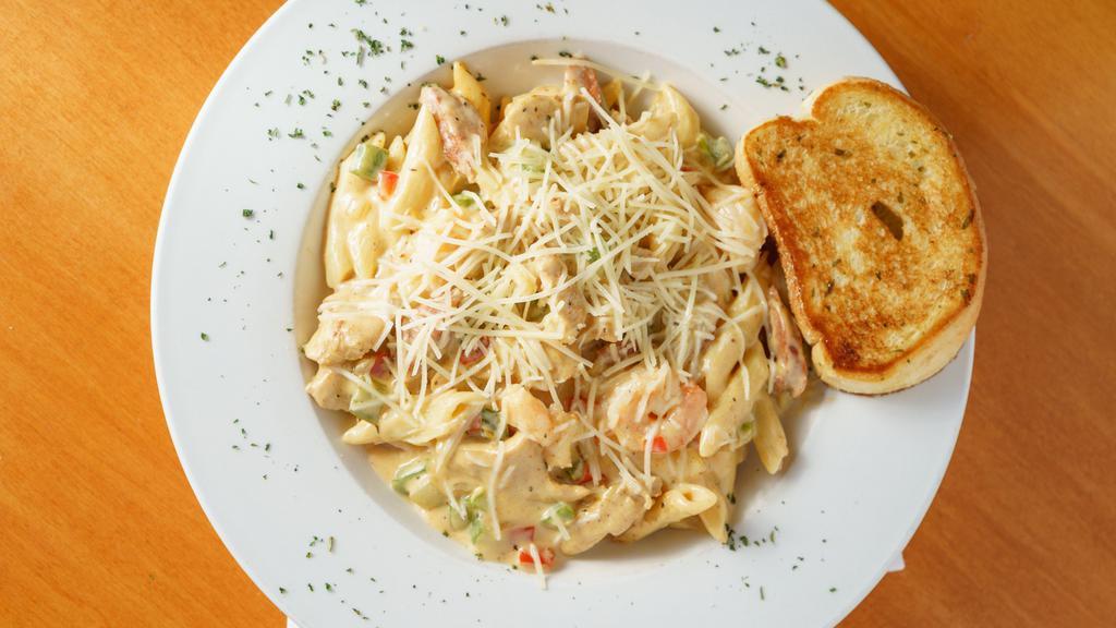 Jambalaya Pasta · Our most popular pasta dish! Shrimp, chicken, and andouille sausage sautéed with onions, tomato and peppers in a zesty creole sauce with penne pasta