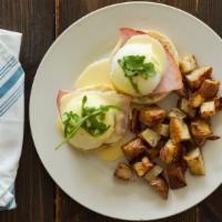 Eggs Benedict · Poached eggs and country ham on English muffin with house-made hollandaise. Served with hash...