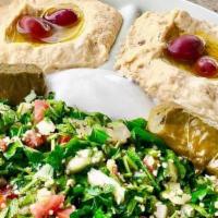 Neomonde Plate · Tabouli, Hummus, Baba Ghanouj, 2 Grape Leaves, a ramekin of Labneh, a drizzle of EVOO, and K...