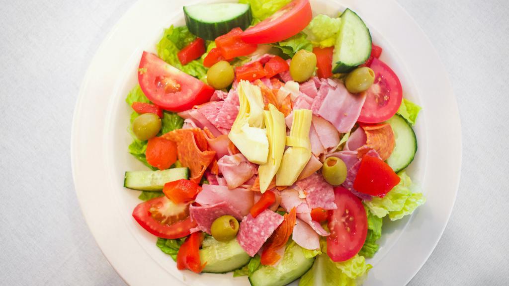Italian Bella Donna Salad · Romaine lettuce, roma tomatoes, cucumbers, cappy ham, genoa salami, pepperoni, roasted red peppers, green olives, topped with oven-roasted turkey and Café Med's herbal vinaigrette.