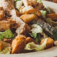 Grilled Chicken Caesar Salad · Romaine lettuce, bell peppers and purple onions tossed in Caesar dressing, topped with grill...