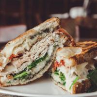 Chicken Pesto Panino · Provolone cheese, oven roasted chicken, basil pesto, baby spinach, sun-dried tomatoes and ma...