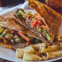 Hero'S Gyro · Gyro meat, spicy feta, lettuce, tomatoes, and spicy giadernia mix. Grilled to create a crisp...
