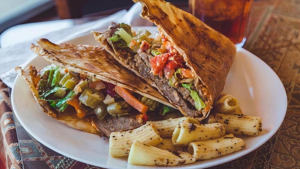 Hero'S Gyro · Gyro meat, spicy feta, lettuce, tomatoes, and spicy giadernia mix. Grilled to create a crispy pita sandwich.