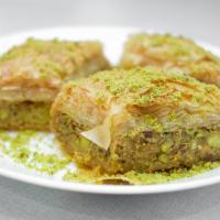 Baklava · Made true to tradition with phyllo dough, crushed pistachios and butter honey syrup.