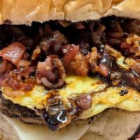 Adult Only Breakfast Burger · Single patty topped with american cheese,  fried egg, smoked bacon, then drizzled with choco...