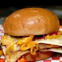 Caliente Burger · Single patty topped with ghost pepper dusted onions, sweet peppers, pepper jack cheese, mang...