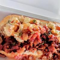 Picnic Dog · Topped with southern style potato salad, raspberry chipotle BBQ sauce and smoked bacon.