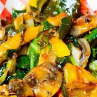 Stir Fry Collard Greens · Fresh collard greens stir fried with mushrooms, Vidalia onions, sweet peppers, and banana pe...