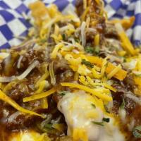 Chili Cheese Fries · Herb seasoned fries topped with home style chili and our own blend of white queso sauce and ...