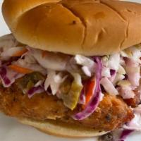 Award Winning Chicken Sandwich · Fried chicken breast topped with a house made cole slaw. Served with fries.