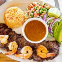 Carne Asada With Shrimp · Grilled skirt steak and shrimp marinated in tequila lime sauce. Served with rice, frijoles d...
