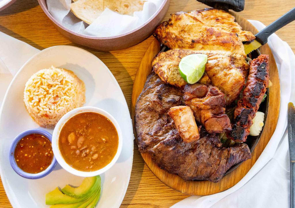 Parrillada Of Mexico City · The best of grilled arrachera, pollo asado, Mexican sausage and pork carnitas. Tequila lime onions and jalapenos on a hot skillet. Served with avocado, rice, chile de arbol sauce, tortillas and frijoles de la olla.