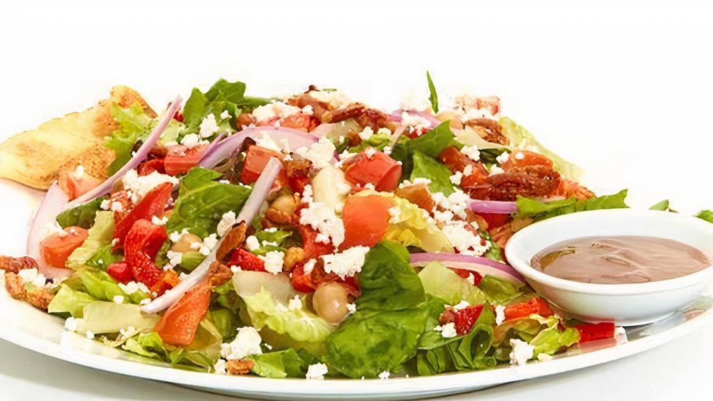 Mediterranean Salad · Mixed lettuces with garbanzo beans, roasted red peppers, red onions, diced tomatoes, roasted pecans, and feta. Served with balsamic vinaigrette.