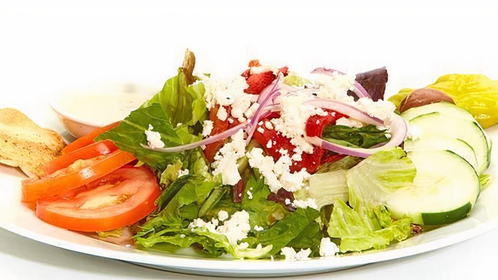 Greek Salad · A mix of lettuces, tomatoes, cucumbers, roasted red peppers, red onions, feta, pepperoncini, Kalamata olives, and Greek dressing.