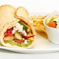 Grilled Veggie Gyro · Pesto aioli, tomatoes, zucchini, squash, grilled red peppers, grilled onion, and feta. Serve...