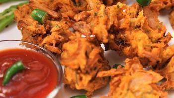 Onion Pakora · Sliced onions dipped in besan flour and fried.