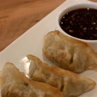 Pork Dumplings (4) · Choice of steamed or pan-fried dumplings. Served with soy sauce.