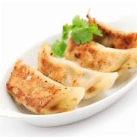 Pan Seared Gyoza · Freshly made dumplings filled with a choice of filling.