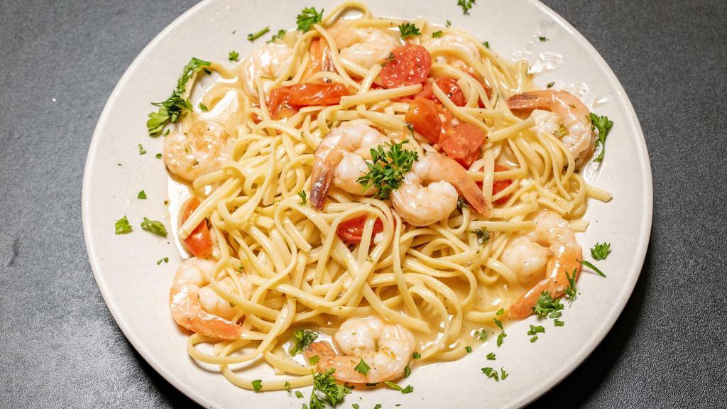 Shrimp Or Salmon Scampi · Black tiger shrimp or salmon filet with garlic in white wine scampi sauce over linguine pasta.