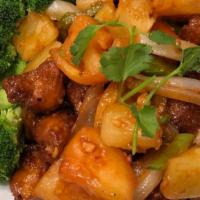 Sweet And Sour Chicken · Meat of your choice tossed with sweet and tangy sauce, bell peppers, onions, pineapple, toma...