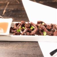 Thai Fried Beef Jerky · Fried marinated Thai herb jerky. Server with Thai chili sauce.
