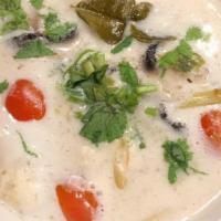Tom Kha Soup  · Coconut lime broth with mushrooms, tomato, cilantro and scallions. Choice of proteins.