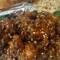 Sesame Chicken · Lightly breaded and sauteed in a sweet brown sauce with sesame seeds and broccoli on the sid...