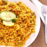 Aago Biryani · Basmati rice cooked with diced chicken, lamb, and shrimp in Indian herbs, yogurt, saffron, M...