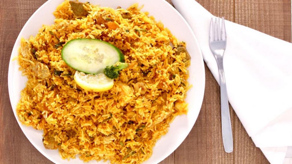 Aago Special Biryani · Basmati rice cooked with diced chicken, lamb and shrimp in Indian herbs, yogurt, saffron, Mint and flavors.