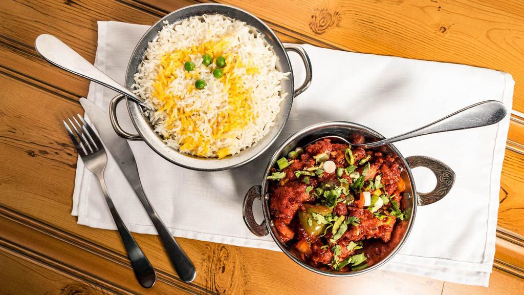 Chicken Chili · Cooked with bell pepper, onions, tomatoes, and hint of spicy chili sauce. Served with rice.