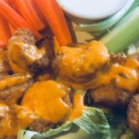 Boom Boom Shrimp · A plateful of hand breaded or grilled shrimp tossed in KaBoom sauce and served with celery, ...