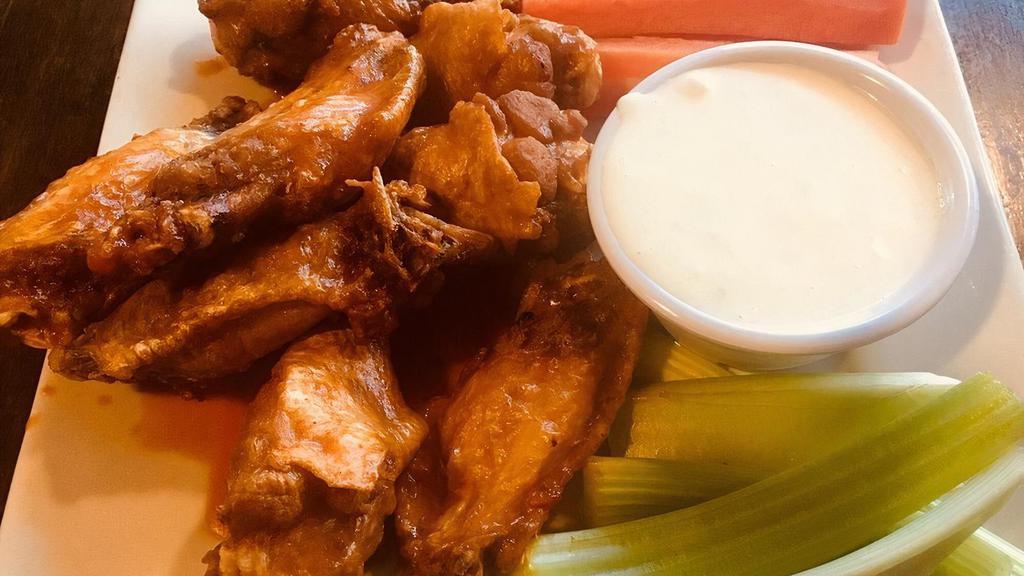 Tavern Wings · A pound of crispy wings tossed in Tavern Signature Sauce, Buffalo Sauce or naked served with celery & carrots and your choice of Ranch or Bleu Cheese