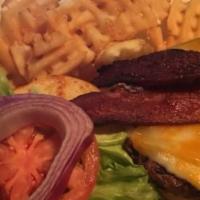 The Tavern Burger · Our signature burger topped with Colby Jack cheese, thick sliced bacon and homemade BBQ sauc...