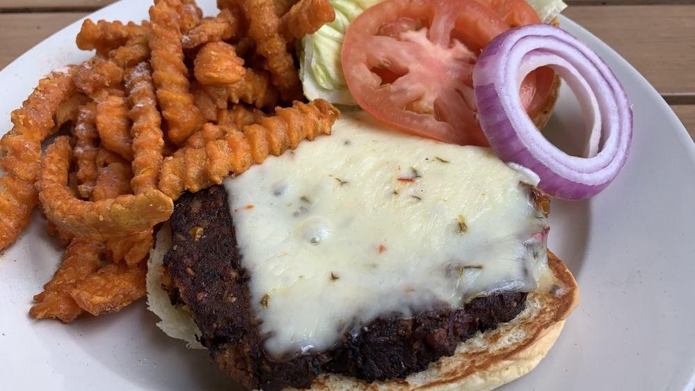 Chipotle Black Bean Burger · A healthy twist with a kick! Topped with Pepper Jack cheese, lettuce, tomato and onion.