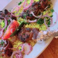 Lamb Chops · Grilled Seasoned Lamb Filet Served Over Basmati Rice